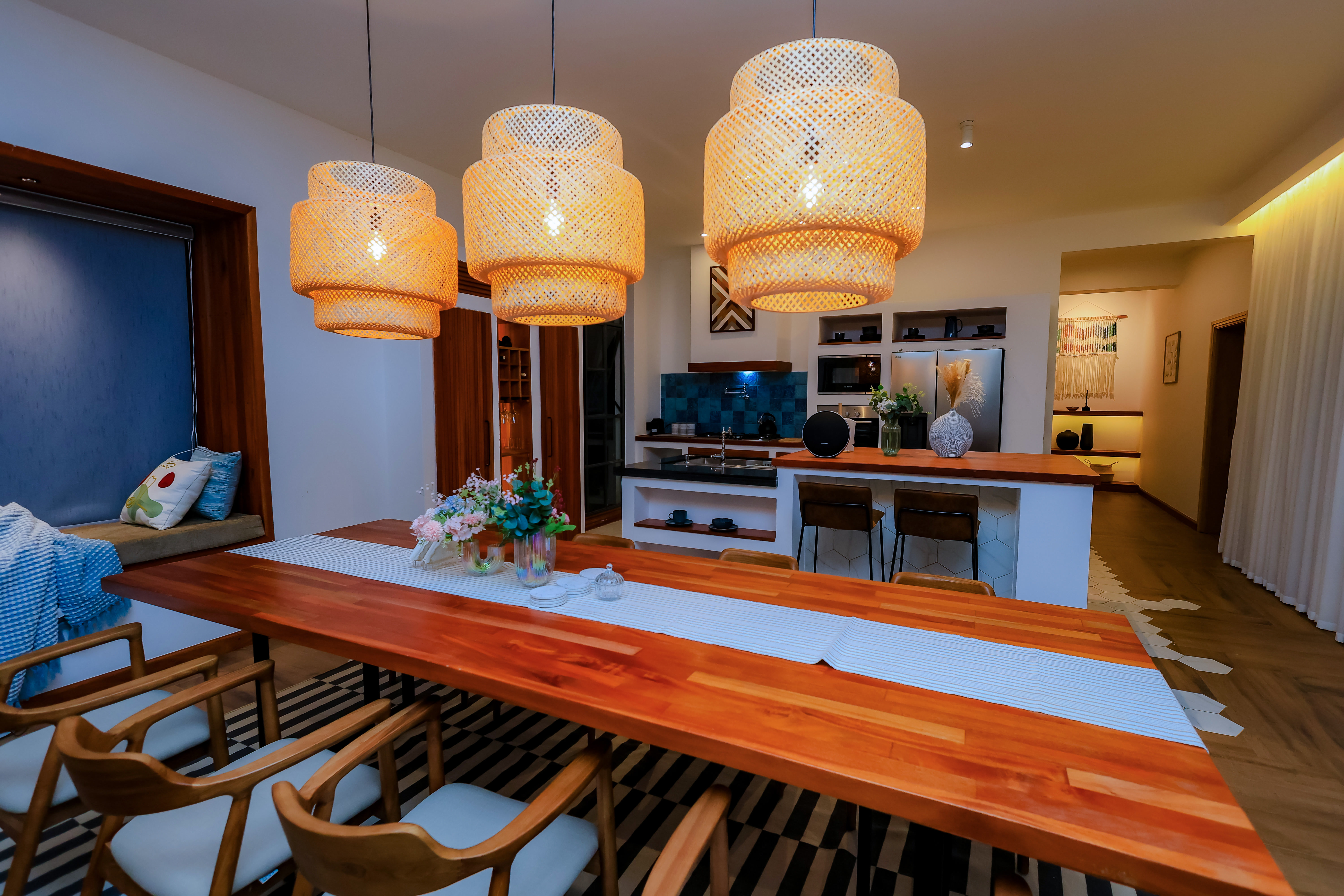 Outdoor lounge area featuring natural stone and wood materials