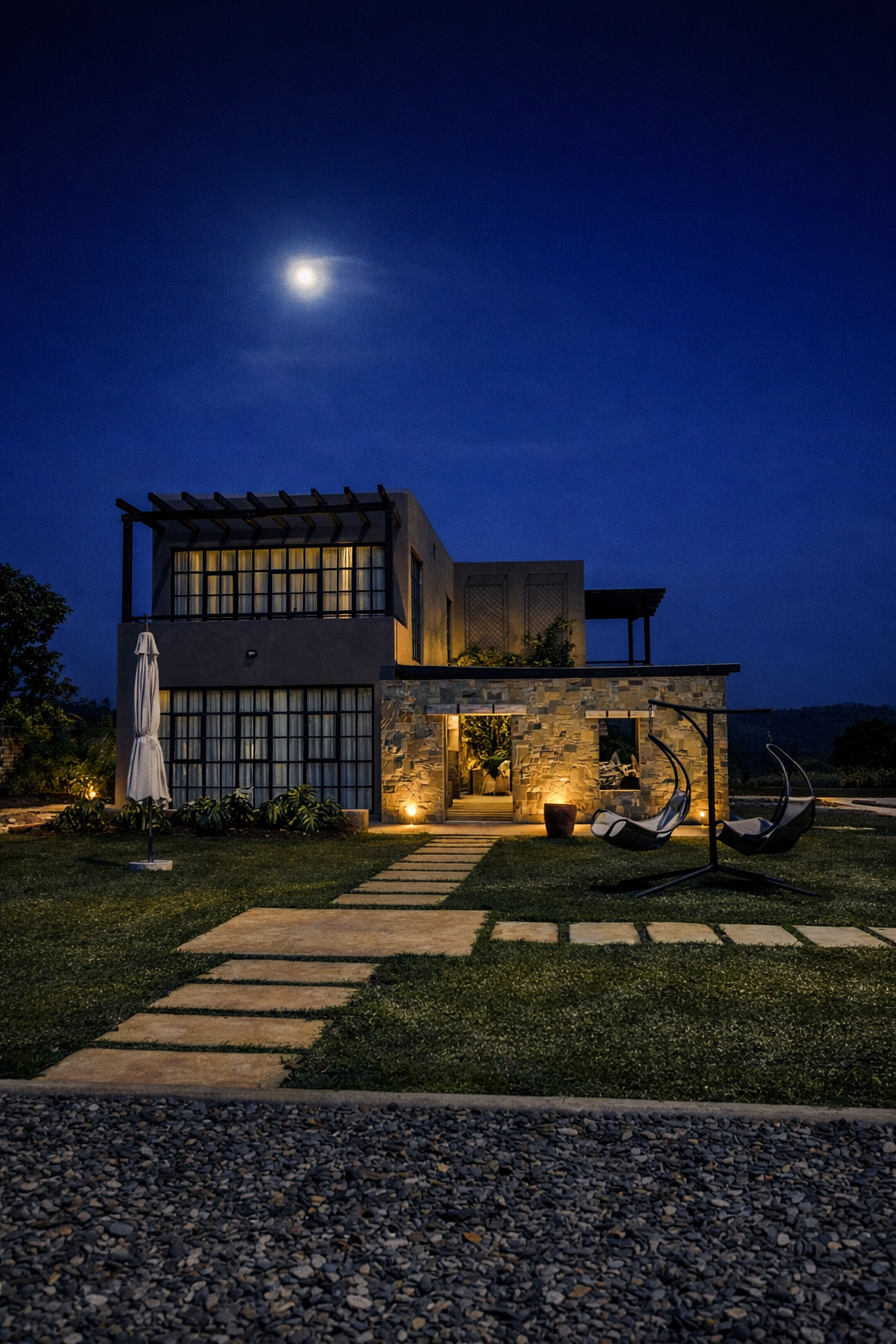 Outdoor lounge area featuring natural stone and wood materials
